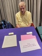 Pictured is GNYCB Board Member Robert White seated at our table at the New York Public Library Resource Fair